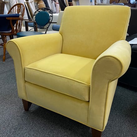 Armchair reupholstered with yellow fabric